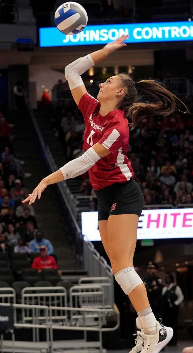 Wisconsin setter Izzy Ashburn (11) serves during their volleyball match against Marquette Wednesday, September 13, 2023 at Fiserv Forum in Milwaukee, Wis. Official attendance was 17,037 making it the largest indoor regular-season crowd for a volleyball match in NCAA history and the largest crowd to see a women s sporting event in Wisconsin history.